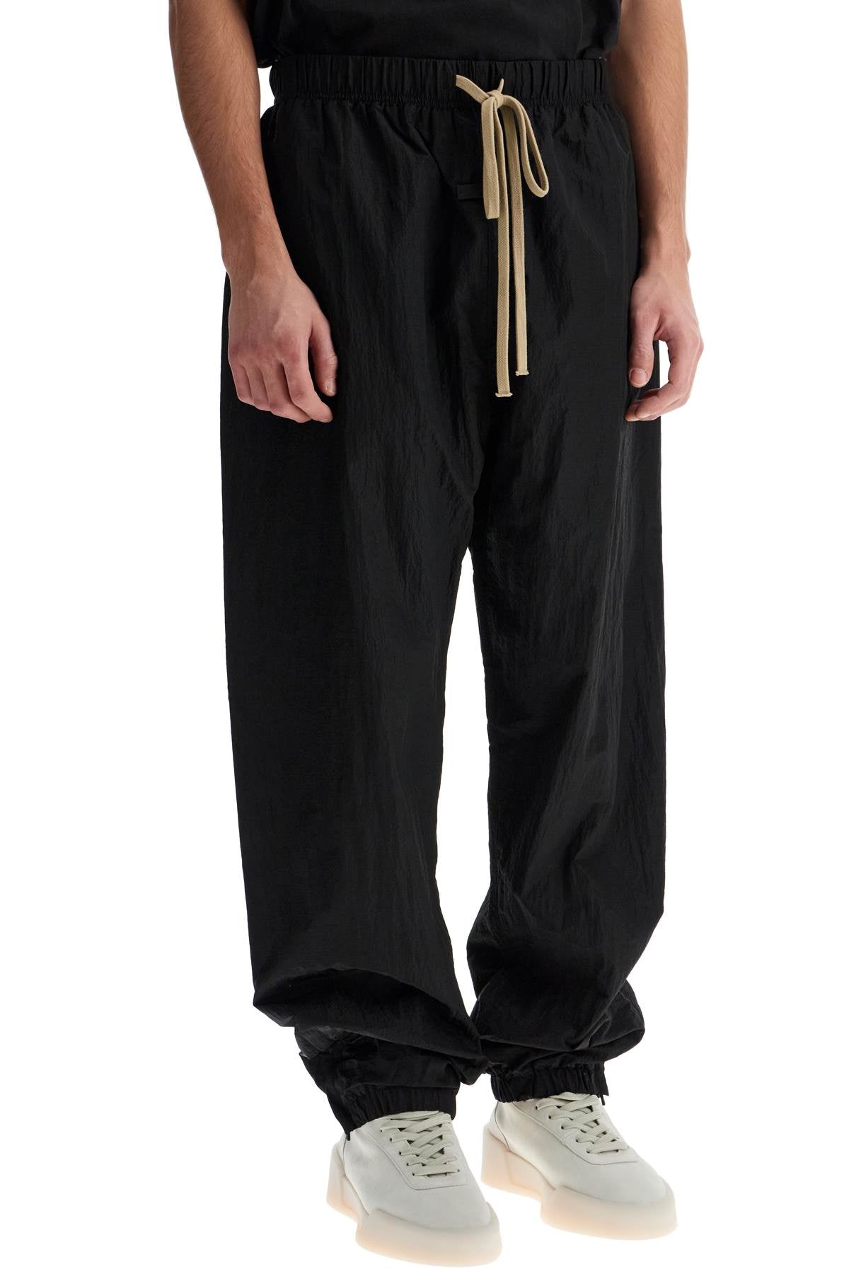 Fear Of God ESSENTIALS nylon ripstop track pants in