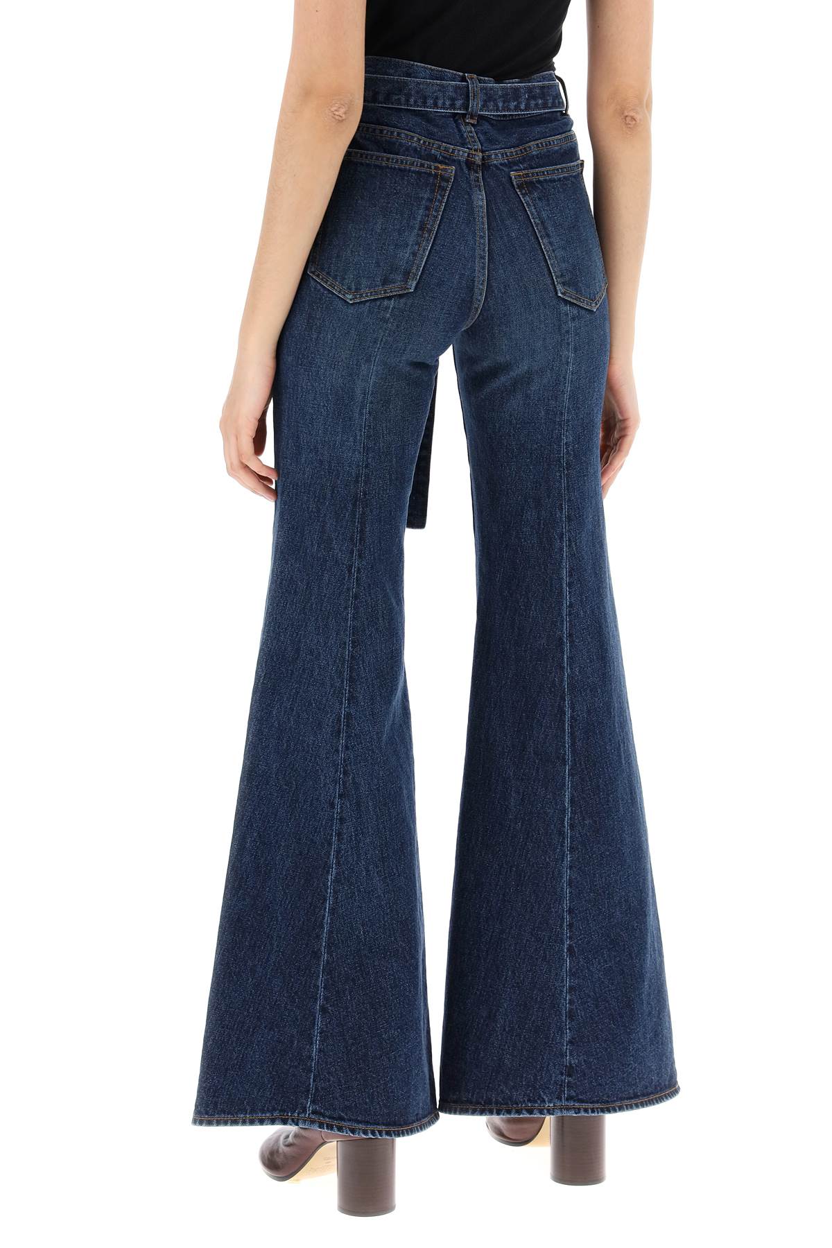 Sacai boot cut jeans with matching belt