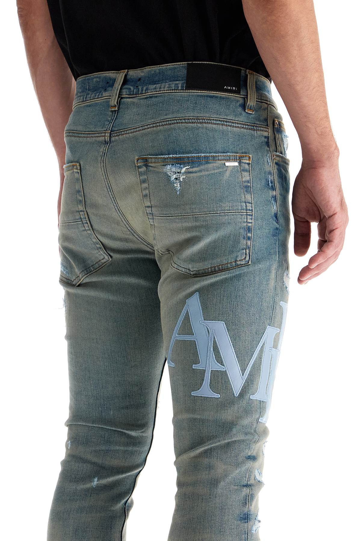 Amiri leather logo jeans with eight words