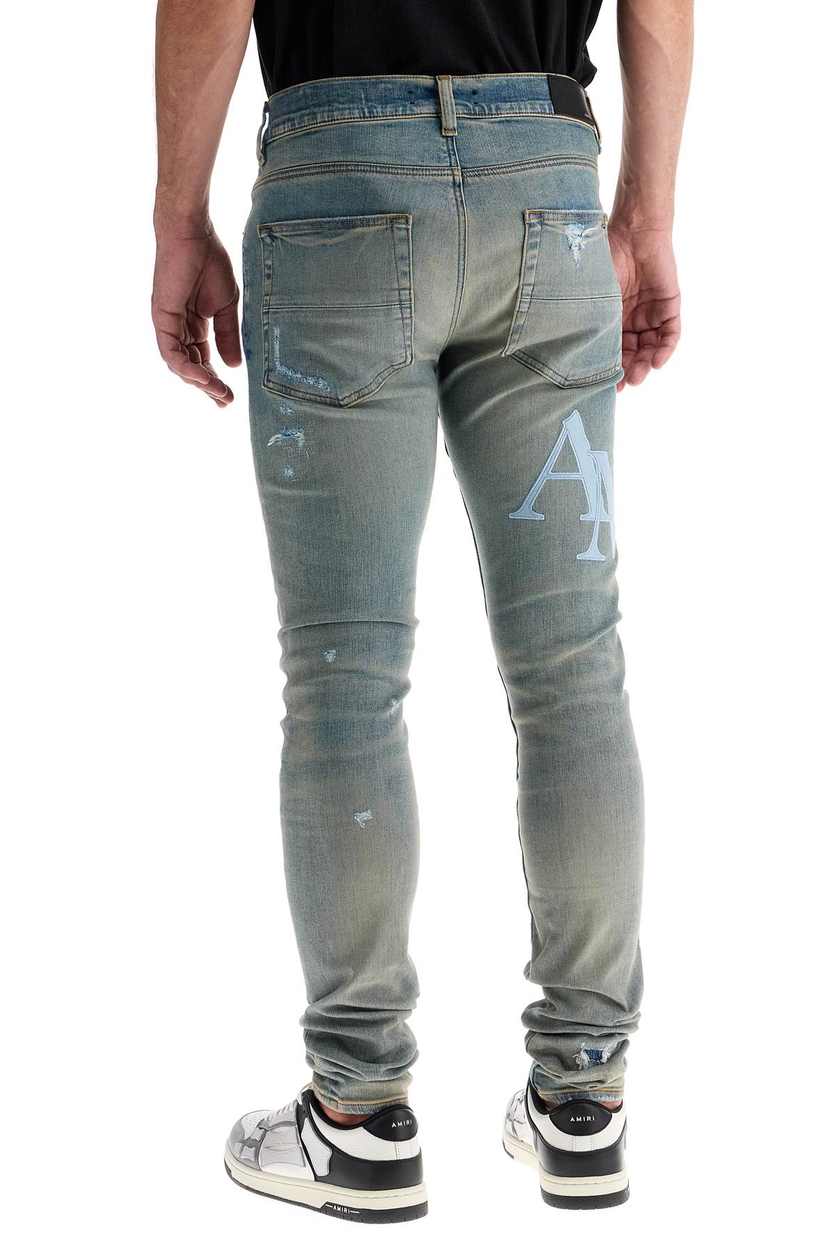 Amiri leather logo jeans with eight words