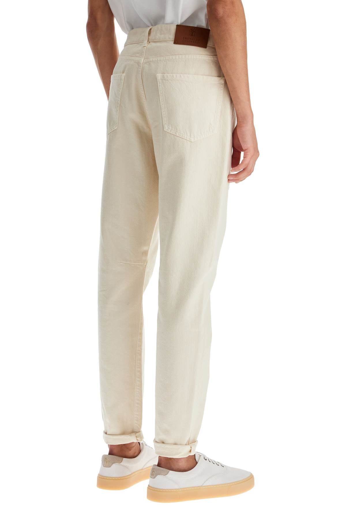 Brunello Cucinelli destroyed leisure fit jeans with distressed details.