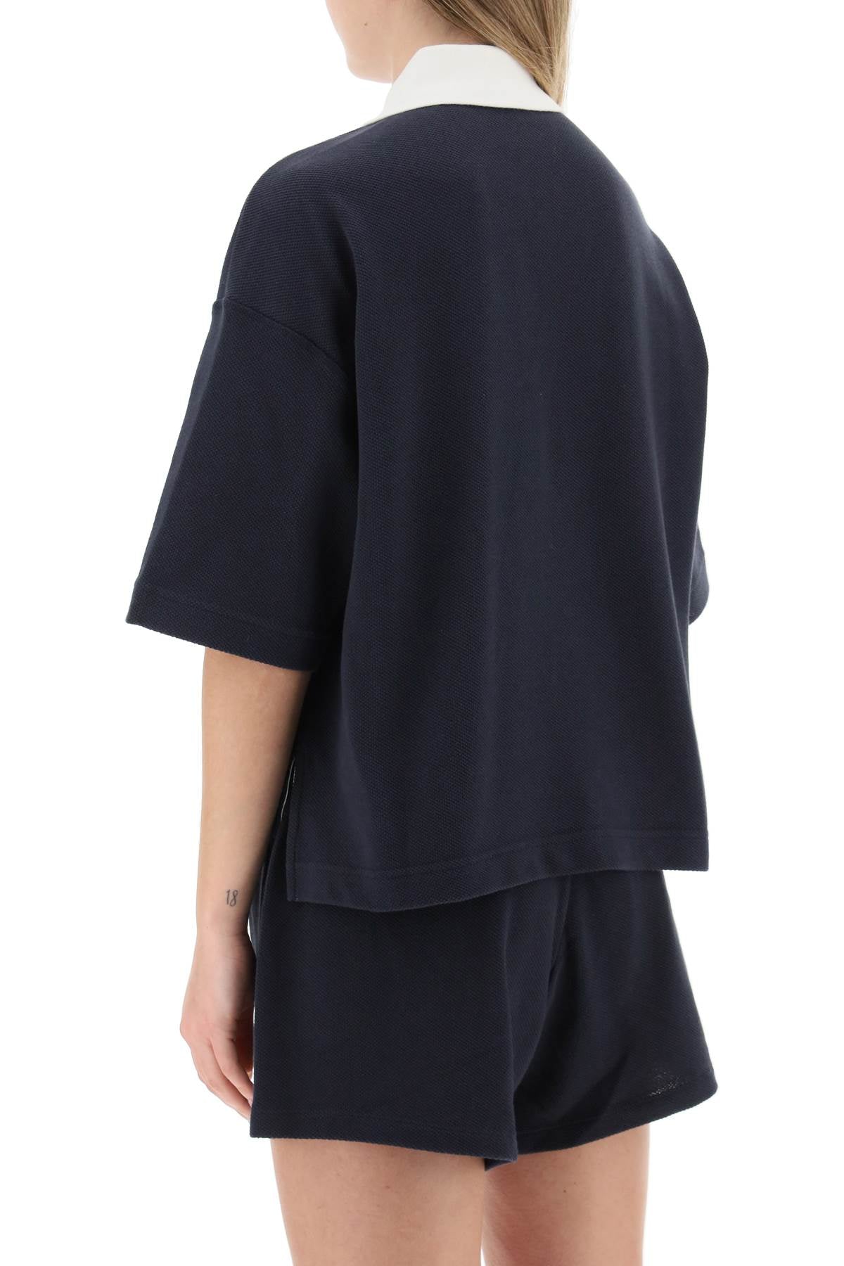 Moncler basic oversized polo shirt with logo patch - ALPHA PANTHEON Opulencia Elegante | Unveiling the Premier Destination for Designer Fashion & Luxury Apparel